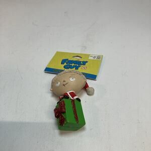 2011 Family Guy’s Stewie Sitting On Green Present Christmas Ornament NOS